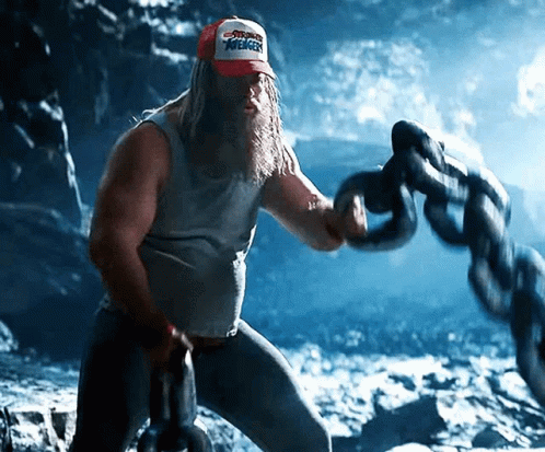A Man With A Beard Wearing A Cap That Says Avengers On It GIF