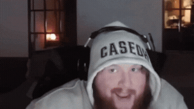 A Man With A Beard Wearing A Cased Hoodie GIF