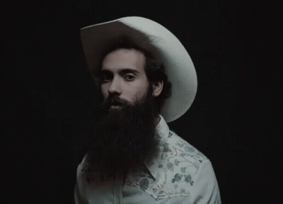 A Man With A Beard Wearing A Cowboy Hat GIF