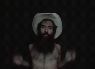 A Man With A Beard Wearing A Cowboy Hat GIF
