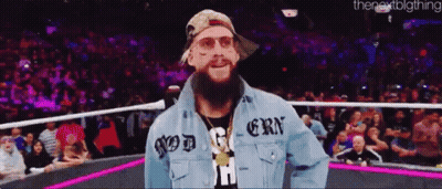 a man with a beard wearing a denim jacket that says god on it
