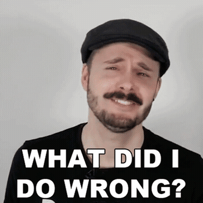 A Man With A Beard Wearing A Flat Cap And A Black Shirt Says What Did I Do Wrong GIF