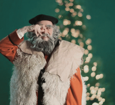 A Man With A Beard Wearing A Fur Vest And A Black Hat GIF