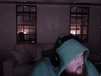A Man With A Beard Wearing A Green Hoodie GIF
