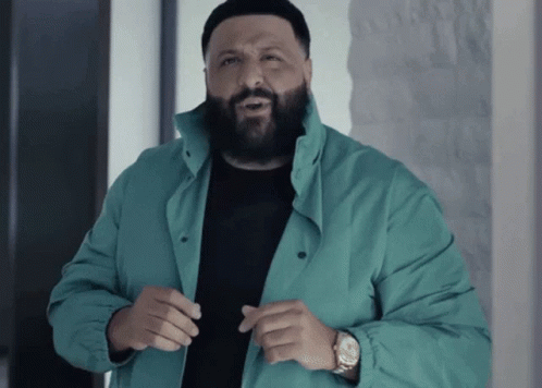 A Man With A Beard Wearing A Green Jacket GIF