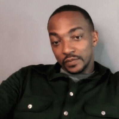 A Man With A Beard Wearing A Green Shirt GIF