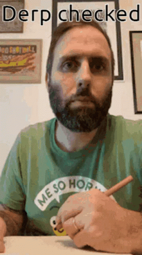 A Man With A Beard Wearing A Green Shirt That Says Me So Hop Is Writing On A Piece Of Paper GIF