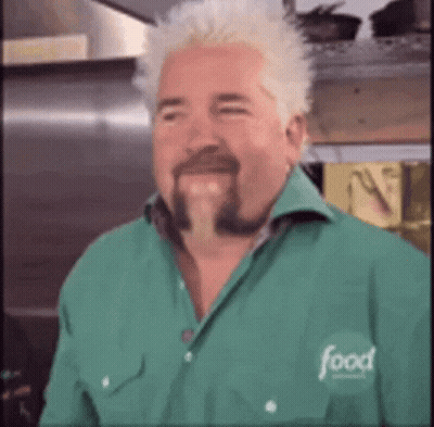 A Man With A Beard Wearing A Green Shirt With The Word Food On It GIF