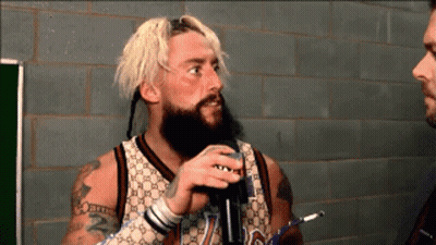 A Man With A Beard Wearing A Gucci Jersey GIF