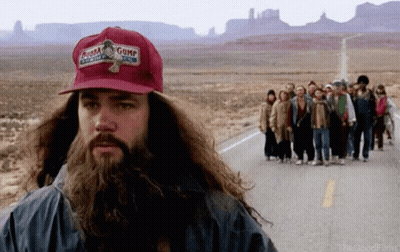 A Man With A Beard Wearing A Gump Hat GIF