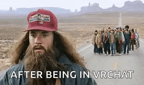 A Man With A Beard Wearing A Gump Hat Is Standing In Front Of A Group Of People Walking Down A Road . GIF