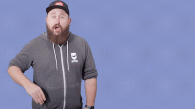 A Man With A Beard Wearing A Hat And A Hoodie That Says Are You On Mute GIF