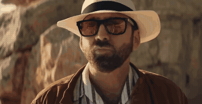 A Man With A Beard Wearing A Hat And Glasses GIF