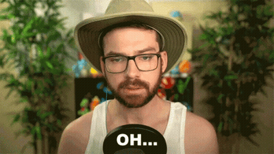 A Man With A Beard Wearing A Hat And Glasses Says " Oh " GIF