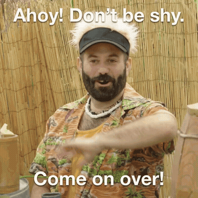 A Man With A Beard Wearing A Hawaiian Shirt Says " Ahoy ! Don 'T Be Shy Come On Over " GIF