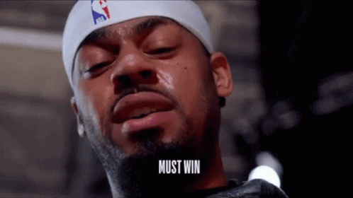 A Man With A Beard Wearing A Headband That Says Must Win GIF