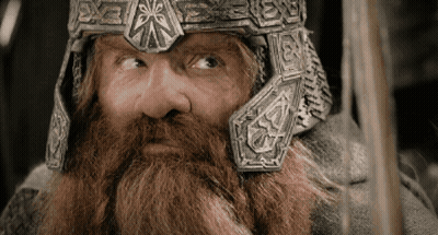 A Man With A Beard Wearing A Helmet That Says ' X ' On It GIF