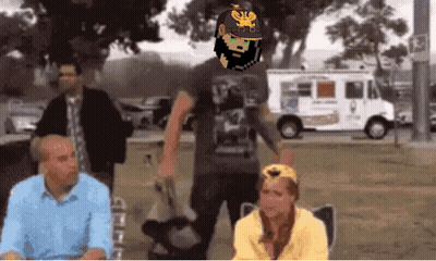 A Man With A Beard Wearing A Helmet With A Eagle On It Stands In Front Of A White Van GIF