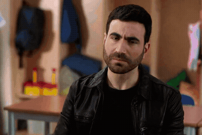 A Man With A Beard Wearing A Leather Jacket GIF