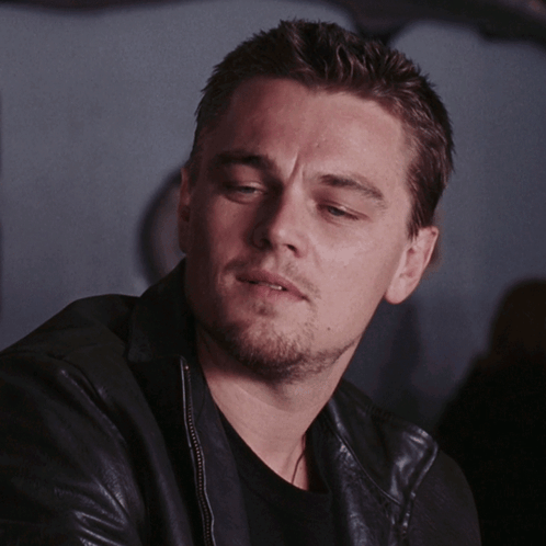 A Man With A Beard Wearing A Leather Jacket GIF