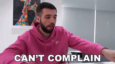 A Man With A Beard Wearing A Pink Nike Hoodie Says " Can 'T Complain " GIF