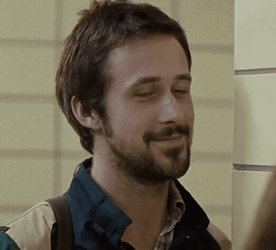 A Man With A Beard Wearing A Plaid Shirt And A Green Jacket GIF