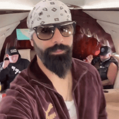 A Man With A Beard Wearing A Puma Jacket GIF