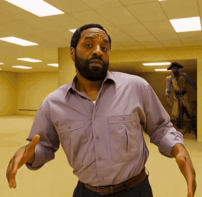 A Man With A Beard Wearing A Purple Shirt GIF
