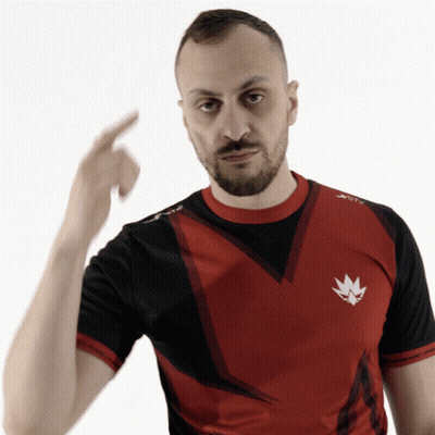 A Man With A Beard Wearing A Red And Black Shirt That Says Xtc GIF