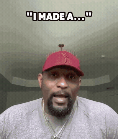 A Man With A Beard Wearing A Red Hat And A Necklace Says " I Made A ... " GIF