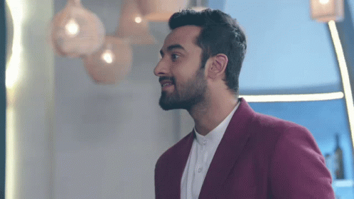 A Man With A Beard Wearing A Red Jacket GIF