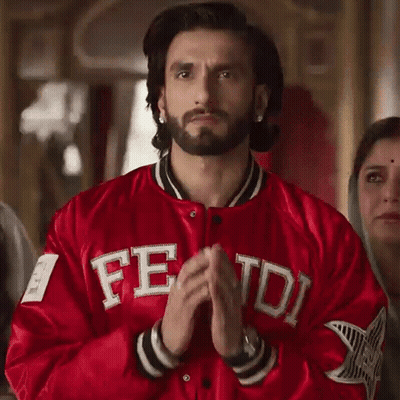 A Man With A Beard Wearing A Red Jacket With The Word Fred On It GIF