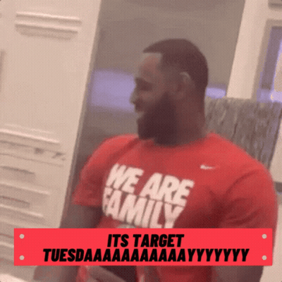 a man with a beard wearing a red shirt that says we are family