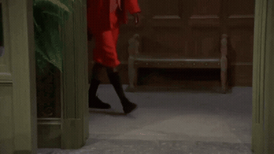 A Man With A Beard Wearing A Red Suit And Sunglasses GIF