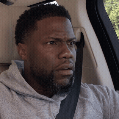 A Man With A Beard Wearing A Seat Belt Looks Surprised GIF