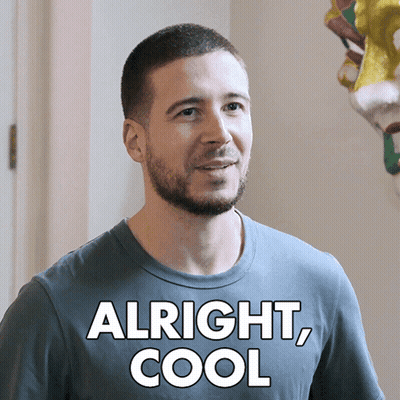 A Man With A Beard Wearing A Shirt That Says Alright Cool GIF