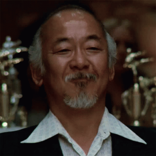 A Man With A Beard Wearing A Shirt That Says ' Ii ' On It GIF