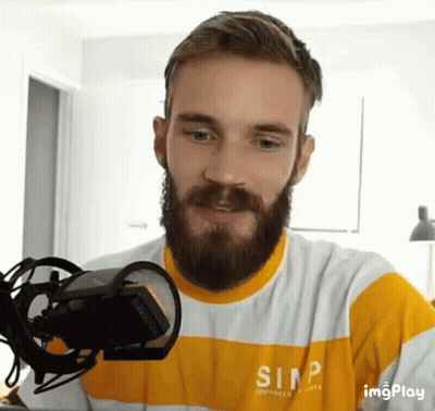 A Man With A Beard Wearing A Shirt That Says Simp On It GIF