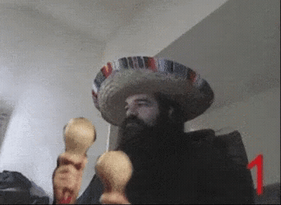 A Man With A Beard Wearing A Sombrero Holds Maracas GIF