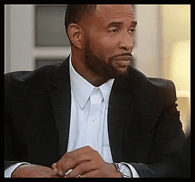 A Man With A Beard Wearing A Suit And A Watch GIF