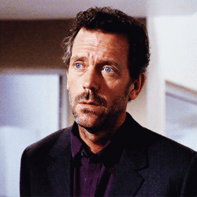 A Man With A Beard Wearing A Suit And Purple Shirt GIF