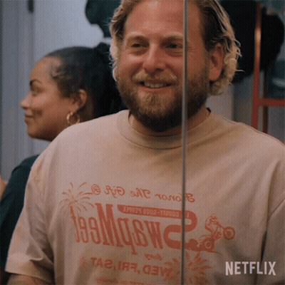 A Man With A Beard Wearing A T-Shirt That Says Netflix GIF