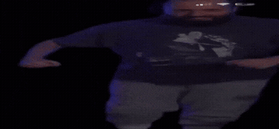 A Man With A Beard Wearing A T-Shirt With A Picture Of A Man On It GIF