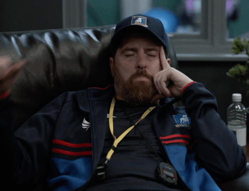 A Man With A Beard Wearing A Teddy Bear Hat Giving A Thumbs Down Sign GIF