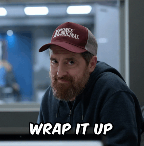 A Man With A Beard Wearing A Trucker Hat That Says ' Tcsines Original ' On It GIF