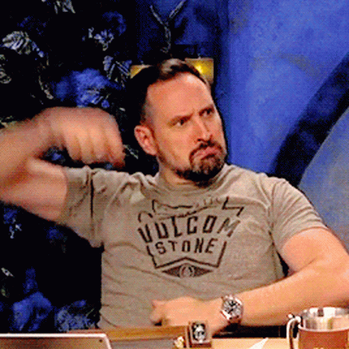 A Man With A Beard Wearing A Volcom Stone T-Shirt GIF