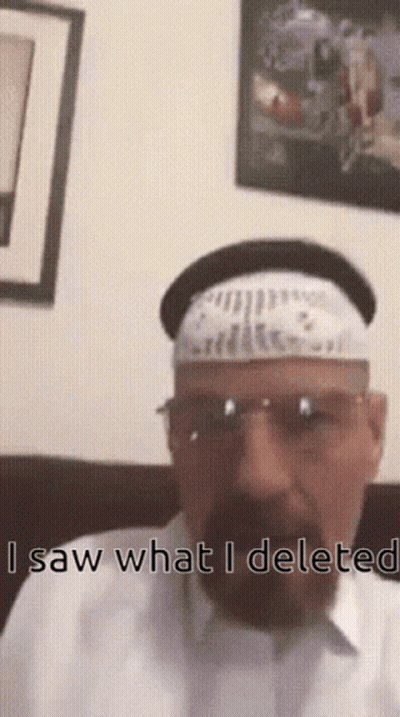 A Man With A Beard Wearing A White Hat And Sunglasses Says " Saw What I Delete " GIF