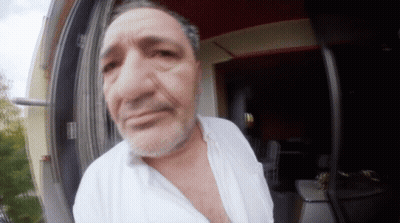 A Man With A Beard Wearing A White Shirt GIF