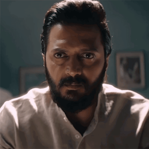 A Man With A Beard Wearing A White Shirt GIF