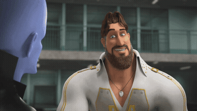 A Man With A Beard Wearing A White Shirt With The Letter V On The Front GIF